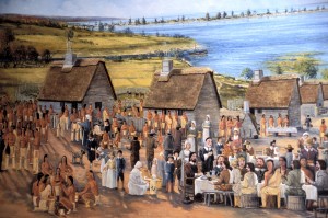 Historic painting of the famous first Thanksgiving feast of the 1621 harvest celebration at Plymouth that included the English colonists and the Wampanoag Indians