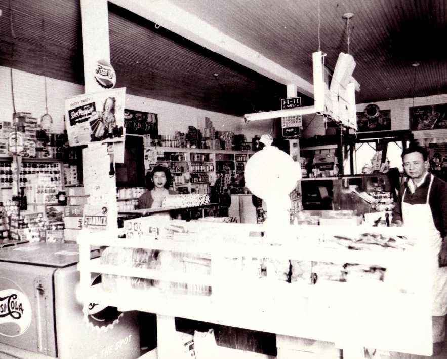 Black and white photograph of a grocery store
