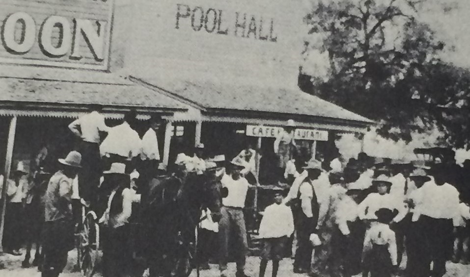 Group of people in front of a pool hall